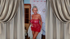Hot housewife Lukerya at home in the kitchen.