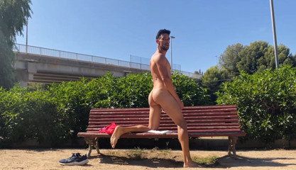 Perfect body man naked on public bench