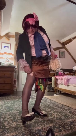 Dressed in a brown mini skirt for her evening thumbnail
