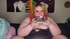 Fat woman eating frosted flakes
