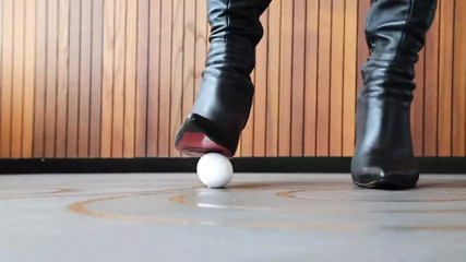 Eggs under Mistress' Heels