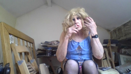 Femboi fag slut Sarah smokes and poses in a black latex dress, then removes it to show off her lingerie thumbnail