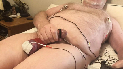 Two ballstretchers combine to pull my balls tight for a beating and hard estim.