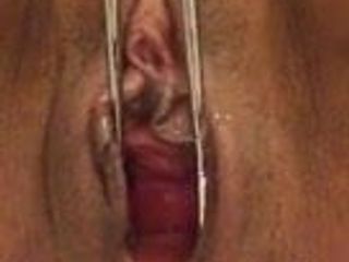 HOT!! Mature sub opens pussy with tongs.....then SQUIRTS!!!