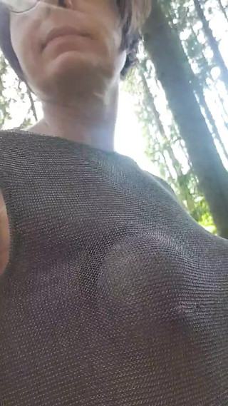 Splashing naked in the forest and going topless