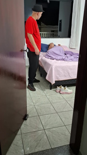 Stepfather helps stepdaughter take off her clothes to go to bed.