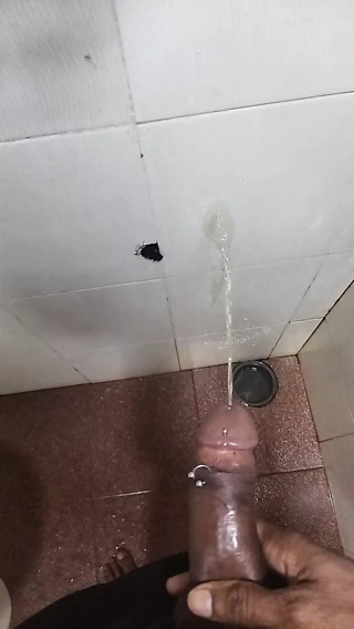 Pissing on the wall, man cock dripping