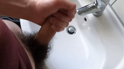 Wanking hairy cock in bathroom and cumming
