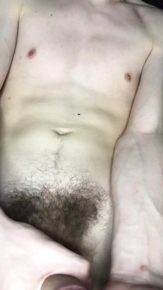 Young man jerking off his big cock