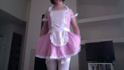 Sissy boy in pink dress bends over