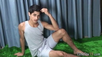 Good-looking twink posing at the studio