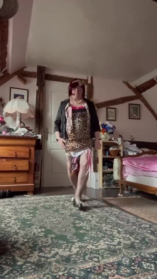 Dressed in a little short leopard dress for an evening thumbnail