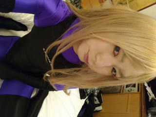 A blonde cross-dressing boy masturbated excitedly wearing purple full-body tights and a competitive swimsuit thumbnail