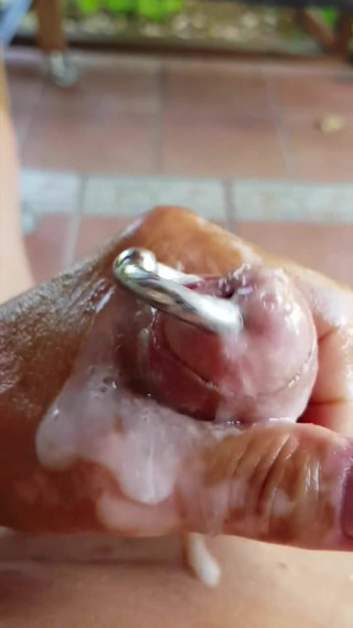 Wanking oiled pierced hard cock and cum
