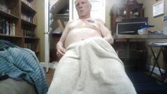 jerking off under a towel.