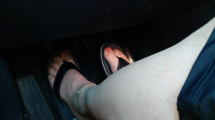 Nylon Feet and Flip Flops in the Car thumbnail