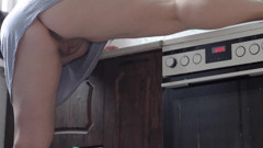A milf cleans the kitchen without panties.