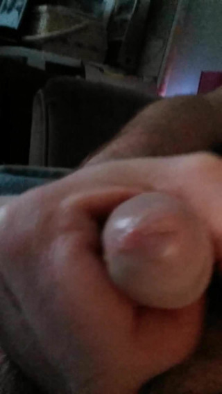 Stroking my limp penis.