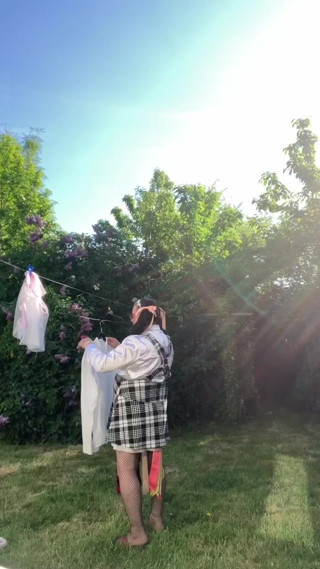 In an outfit with a skirt with straps for an evening thumbnail