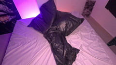 Girl in Garbage Bag Plays with Her Breath