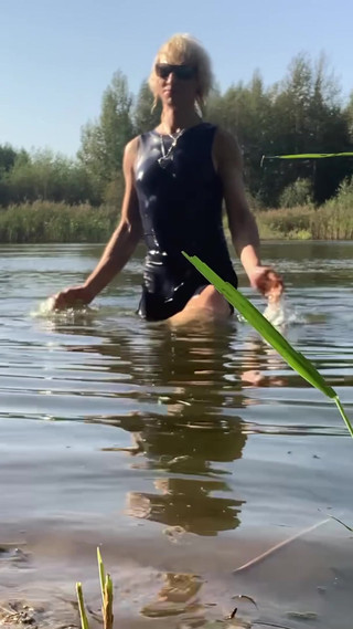 Trans Girl Swimming In The Lake In Blue Sport Dress. Wetllok Trans Girl Wet