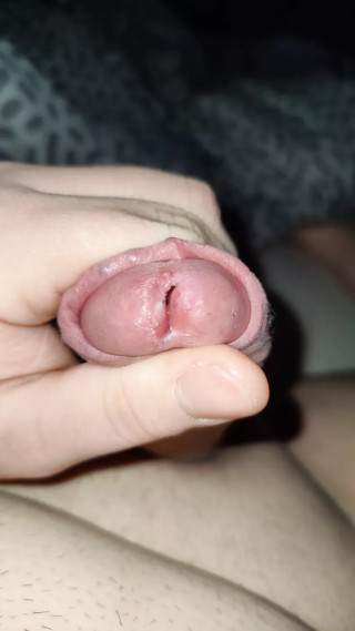 Jizzi teases his cock until the precum is dripping
