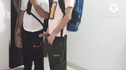 Two college students having gay fun in school library