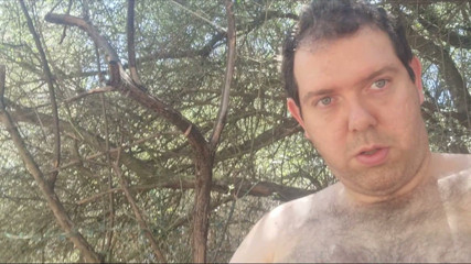 I touch myself behind a tree on the street