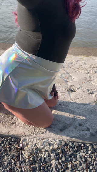 Sissy in miniskirt and chastity with big dildo outdoor