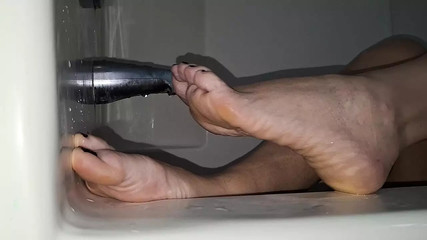 Showing off her beautiful feet in the bath