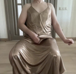 Cuckold sissy trap masturbating in a golden satin silk long maxi dress thumbnail