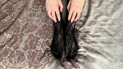 Girl Caresses Her Legs And Gives A Blowjob To The Guy Behind The Scenes With Moans