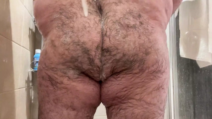 Bear Shoves Dildo up His Ass Before Showering