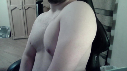 Hot beefy camboy shows off the goods during a show