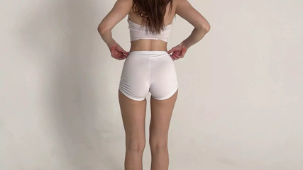 stretching of a beautiful blonde in short shorts