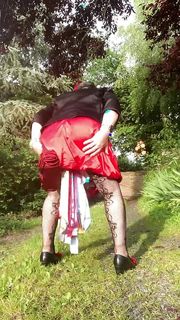 Dressed with a red strapless dress for a night out