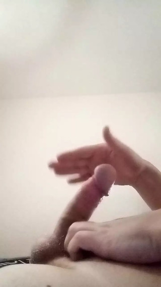 Guy jerking off uncircumcised cock on the table  #13