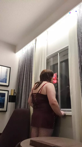 Kelli practices deepthroat infront of the window.