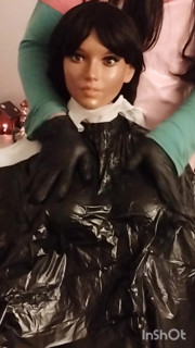 Ebony Sex doll Nikki shows off vinyl shampoo capes