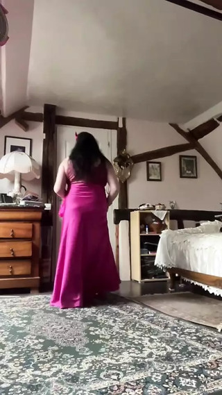 In a long fuchsia dress outfit for a night out