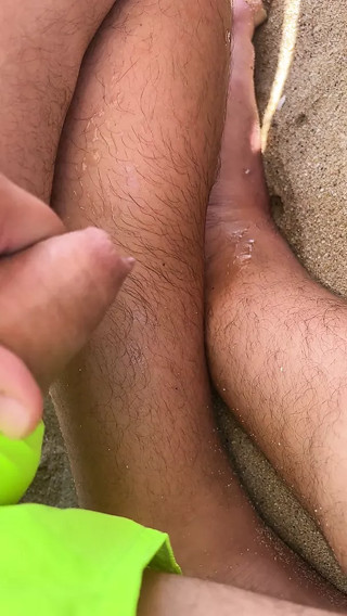 Pissing and cumming on beach