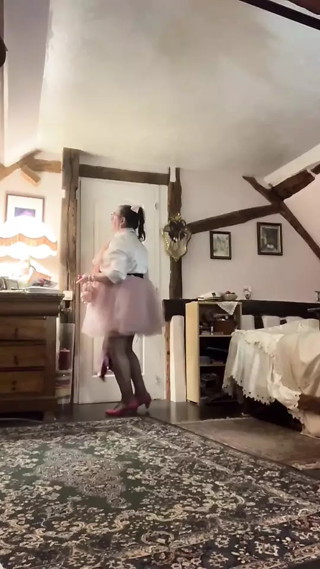 Wear a pink skirt or petticoat and a white blouse