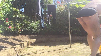 Hanging out washing in g string and naked in garden