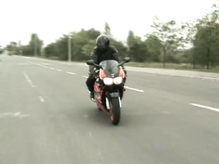 Two bikers caught the young redhead to have a hot 3some