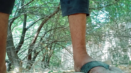 Boy masturbating in the dense forest
