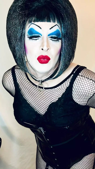 Slut in heavy makeup, PVC is all horny, talks dirty, sucks dildo, and more thumbnail