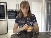 Seductively Eating an orange