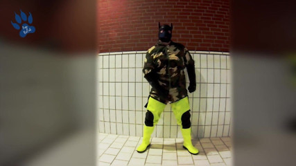Pawing off in camo painter's overall and hi-viz waders