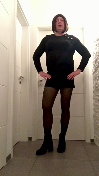 Nicki crossdress black knitted dress, tights and Chelsea boots
