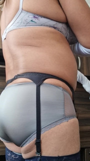 Having pleasure in gray nylon lingerie, granny panties and bra